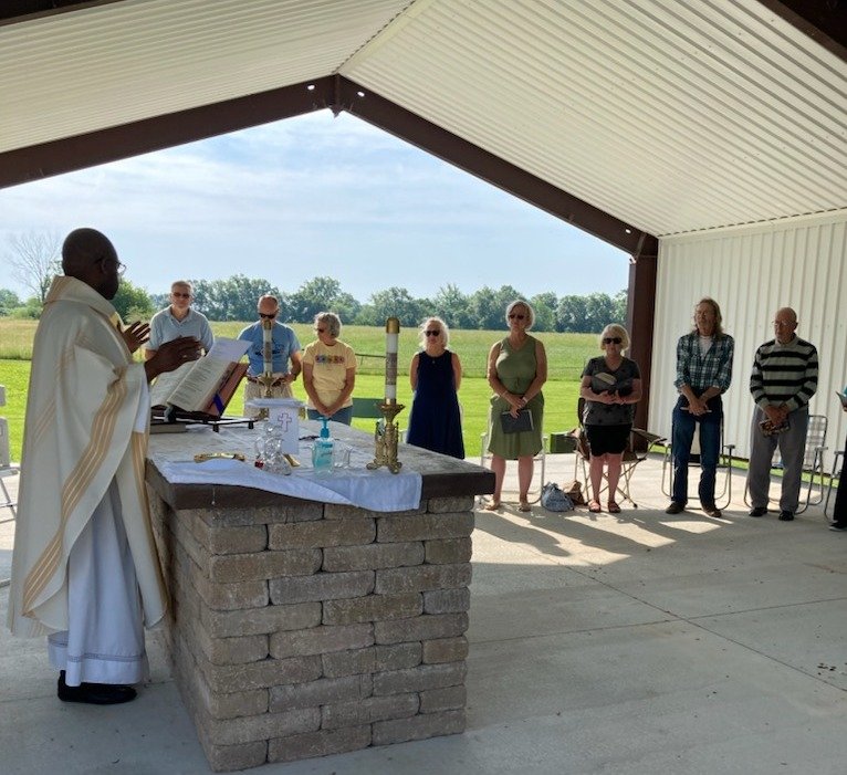 Father Ernest Dike, parochial administrator of Immaculate Conception Parish in Montgomery City, St. Patrick Parish in Jonesburg, and Church of the Resurrection Parish in Wellsville, offers Mass in the pavilion of St. Mary Cemetery in Montgomery City.